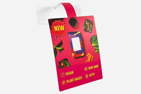 Custom shelf wobbler with NEW badge and vegan, non-GMO callouts