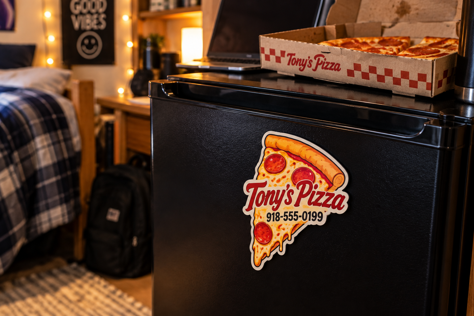 die-cut-pizza-slice-fridge-magnet Die cut pizza slice magnet with a pizzeria phone number on a dorm room mini fridge