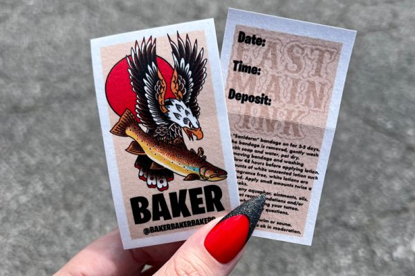 Custom back print stickers for Baker tattoo studio with illustrated front design and appointment details on reverse